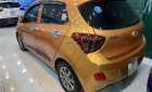 Hyundai Grand i10   2016 - Cần bán lại xe Hyundai Grand i10 1.2AT năm 2016, màu vàng, nhập khẩu  