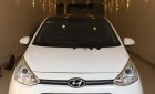 Hyundai Grand i10   1.2 AT 2014 - Cần bán lại xe Hyundai Grand i10 1.2 AT đời 2014, màu trắng, nhập khẩu nguyên chiếc