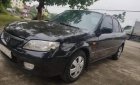 Mazda 323 2002 - Cần bán lại xe Mazda 323 sản xuất 2002, màu đen xe nguyên bản