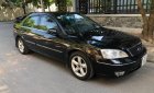 Ford Mondeo   2004 - Cần bán xe Ford Mondeo 2.0 AT năm sản xuất 2004, màu đen, 200tr