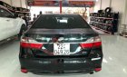 Toyota Camry 2016 - Cần bán gấp Toyota Camry 2.0E đời 2016, màu đen xe còn mới nguyên