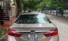 Toyota Camry 2013 - Cần bán gấp Toyota Camry năm 2013, màu vàng