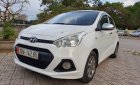 Hyundai Grand i10 2015 - Cần bán gấp Hyundai Grand i10 năm 2015, màu trắng, nhập khẩu số sàn