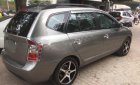 Kia Carens   2010 - Bán xe cũ Kia Carens SX 2.0 AT đời 2010, màu nâu