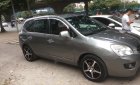 Kia Carens   2010 - Bán xe cũ Kia Carens SX 2.0 AT đời 2010, màu nâu