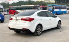 Kia K3 2014 - Cần bán gấp Kia K3 2.0 AT sản xuất năm 2014, màu trắng