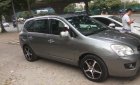 Kia Carens   2010 - Bán xe cũ Kia Carens SX 2.0 AT đời 2010, màu nâu