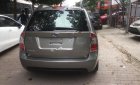 Kia Carens   2010 - Bán xe cũ Kia Carens SX 2.0 AT đời 2010, màu nâu