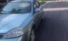 Daewoo Lacetti  1.8 MT 2004 - Cần bán gấp Daewoo Lacetti 1.8 MT sản xuất năm 2004, màu xanh lam, 94tr