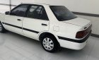 Mazda 323 1995 - Cần bán gấp Mazda 323 đời 1995, màu trắng