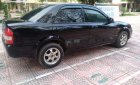 Mazda 323 2004 - Bán ô tô Mazda 323 2004, màu đen