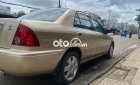 Ford Laser     2002 - Cần bán gấp Ford Laser đời 2002, màu vàng còn mới, giá 145tr