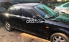 Mazda 323 2003 - Cần bán gấp Mazda 323 đời 2003, màu đen, nhập khẩu 