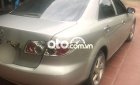 Mazda 6  MT 2004 - Cần bán gấp Mazda 6 MT 2004, màu vàng cát