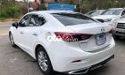 Mazda 3   1.5L AT 2015 - Bán Mazda 3 1.5L AT sản xuất 2015, màu trắng xe gia đình, giá tốt