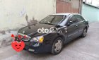 Daewoo Magnus 2004 - Cần bán lại xe Daewoo Magnus năm 2004, màu đen, giá 180tr