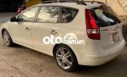 Hyundai i30 CW 1.6AT 2009 - Cần bán lại xe Hyundai i30 CW 1.6AT năm 2009, màu trắng