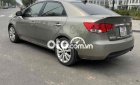 Kia Cerato 2010 - Bán Kia Cerato 1.6AT Deluxe sản xuất 2010, màu xám