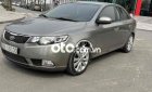 Kia Cerato 2010 - Bán Kia Cerato 1.6AT Deluxe sản xuất 2010, màu xám