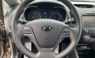 Kia K3 2014 - Cần bán gấp Kia K3 1.6AT sản xuất năm 2014, màu vàng cát, giá cạnh tranh