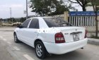 Mazda 323 2004 - Cần bán lại xe Mazda 323 sản xuất năm 2004, màu trắng