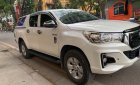 Toyota Hilux 2018 - Cần bán lại xe Toyota Hilux 2.4E năm 2018, màu trắng, xe nhập số tự động