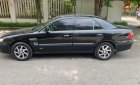Mazda 626 2001 - Xe màu đen