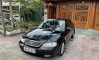 Ford Mondeo 2004 - Màu đen, giá chỉ 128 triệu