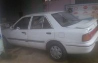 Mazda 323 1995 - Cần bán xe Mazda 323 đời 1995, màu trắng giá 50 triệu tại Bình Thuận  