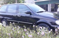 Kia Carnival 2007 - Cần bán Kia Carnival đăng ký 2007, màu đen còn mới, giá tốt 235tr giá 235 triệu tại Hải Dương