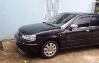 Ford Laser GHIA 1.8 MT 2004 - Cần bán gấp Ford Laser GHIA 1.8 MT năm 2004, màu đen giá 249 triệu tại Sơn La