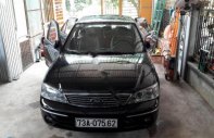 Ford Laser Ghia 1.8 AT 2005 - Bán Ford Laser Ghia 1.8 AT 2005, màu đen số tự động giá 260 triệu tại Quảng Bình