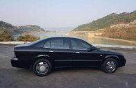 Daewoo Magnus 2004 - Bán xe Daewoo Magnus đời 2004, màu đen giá 145 triệu tại Hòa Bình