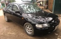 Mazda 323 1997 - Bán xe Mazda 323 đời 1997, màu đen, 95 triệu giá 95 triệu tại Quảng Trị