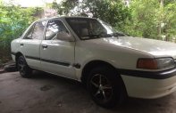 Mazda 323 1.6 MT 2001 - Cần bán gấp Mazda 323 1.6 MT năm 2001, màu trắng giá 68 triệu tại An Giang