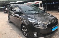 Kia Rondo AT 2015 - Bán Kia Rondo AT năm sản xuất 2015, màu nâu, máy dầu, xe 7 chỗ giá 596 triệu tại Tp.HCM