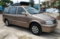 Kia Carnival GS 2009 - Cần bán xe Kia Carnival GS sản xuất 2009, màu vàng số tự động giá cạnh tranh giá 268 triệu tại Tiền Giang