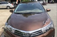 Toyota Corolla altis AT 2015 - Cần bán lại xe Toyota Corolla altis AT sản xuất 2015, màu nâu chính chủ giá 625 triệu tại Bình Dương