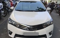 Toyota Corolla altis MT 2015 - Gia đình cần bán xe Altis 2015, số sàn, màu trắng, gia đình sử dụng giá 574 triệu tại Tp.HCM