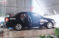 Kia Spectra   2004 - Cần bán xe Kia Spectra đời 2004, màu đen giá 117 triệu tại Bình Định