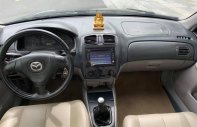 Mazda 323 2003 - Cần bán xe Mazda 323 đời 2003, màu đen, xe đẹp  giá 160 triệu tại Tuyên Quang