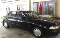 Mazda 626 1996 - Cần bán Mazda 626 sản xuất 1996, màu đen xe gia đình, 70 triệu giá 70 triệu tại TT - Huế