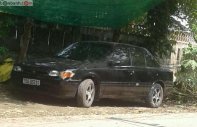 Mazda 323 1.6 MT 1997 - Cần bán xe Mazda 323 1.6 MT đời 1997, màu đen, xe nhập giá 68 triệu tại TT - Huế