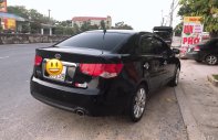 Kia Forte SX 1.6 MT 2011 - Bán xe Kia Forte SX 1.6 MT năm sản xuất 2011, màu đen xe gia đình giá 325 triệu tại Quảng Bình