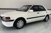 Mazda 323 1995 - Cần bán gấp Mazda 323 đời 1995, màu trắng giá 42 triệu tại Quảng Nam