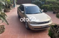 Ford Laser    2002 - Cần bán gấp Ford Laser 2002, màu vàng giá 115 triệu tại Vĩnh Phúc