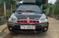 Kia Spectra 2004 - Cần bán gấp Kia Spectra đời 2004, màu đen, 85tr giá 85 triệu tại Kon Tum