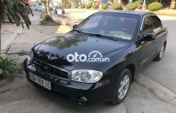 Kia Spectra 2005 - Cần bán gấp Kia Spectra 2005, màu đen giá cạnh tranh giá 115 triệu tại Hòa Bình