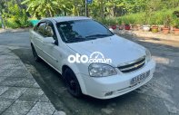 Daewoo Lacetti   EX  2010 - Cần bán gấp Daewoo Lacetti EX năm 2010, màu trắng chính chủ giá 195 triệu tại Tp.HCM