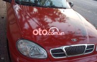 Daewoo Lanos 2002 - Cần bán xe Daewoo Lanos MT đời 2002, màu đỏ, xe nhập còn mới, giá chỉ 55 triệu giá 55 triệu tại Tiền Giang